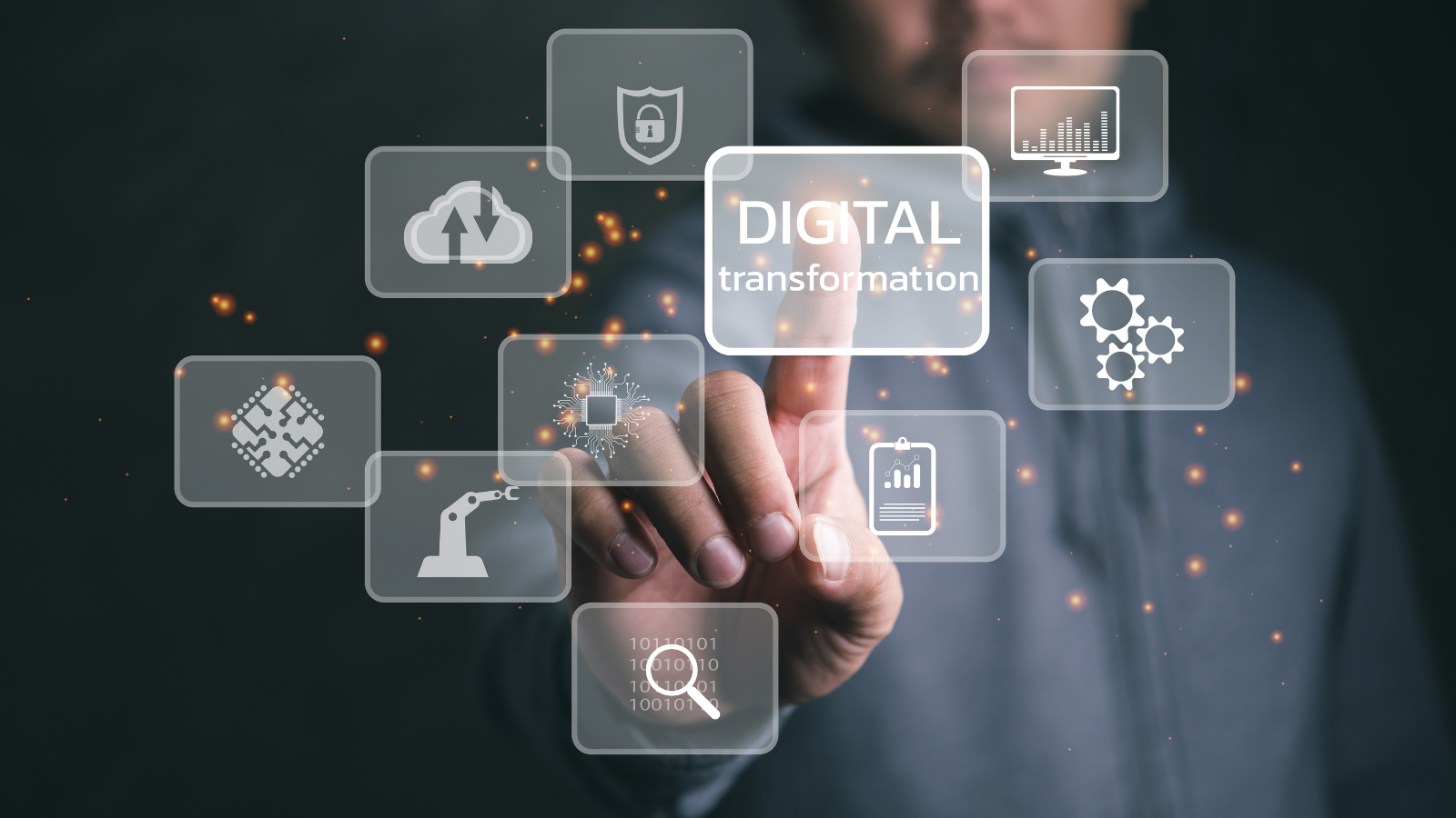 A person in a hoodie touching a transparent digital interface with floating technology icons, highlighting the term “Digital Transformation.”